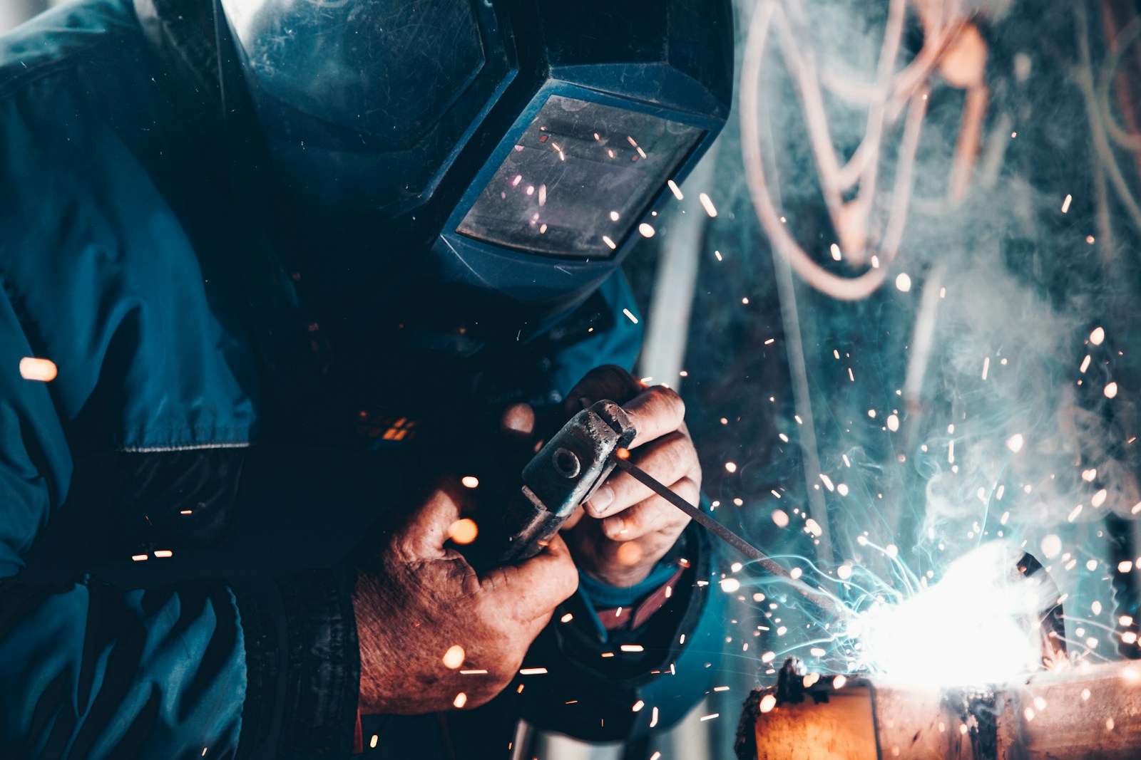 Skilled trades professional welding in an industrial workplace